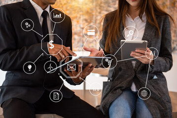 Business People Talking Discussing with financial document data charts and graphs Team business meeting with smart phone and laptop and digital tablet with icon