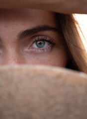 Caucasian young woman green eye close up