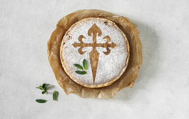 Santiago's cake is a traditional cake from Galician cuisine, mint leaves , top view, copy space
