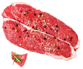 Fresh beef steak isolated on white background, top view. Raw meat fillet with spices and herbs.