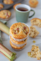 home made almond rhubarb muffins on a table