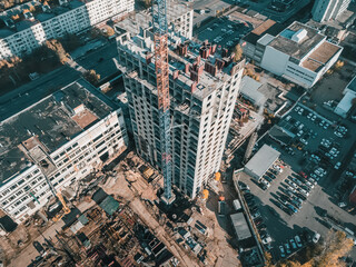 Aerial view of construction crane at building site. Industrial concept