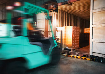 Naklejka premium Blur Motion of Workers Driving Forklift Loading Cargo Pallets into Container Trucks. Shipping Warehouse. Delivery Service Shipment Boxes. Supply Chain Goods. Warehouse Cargo Logistics Transport.
