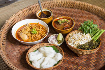 Khao soi gai and kanom jin. Thai coconut milk curry noodles- Northeast Food of Thailand