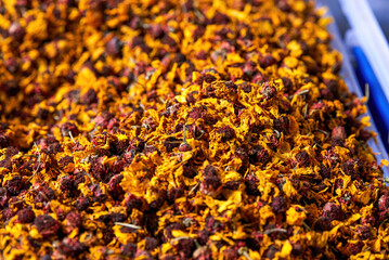 A pile of golden dried chrysanthemums close-up