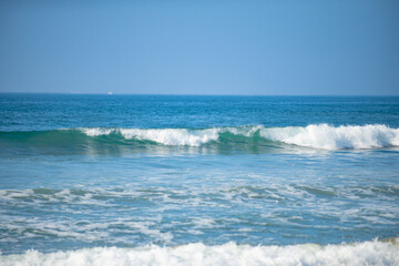 Ocean or sea tropical waves. Ocean background, seascape. Tropical beach with wave, nature background. Copy space of summer vacation and travel concept.