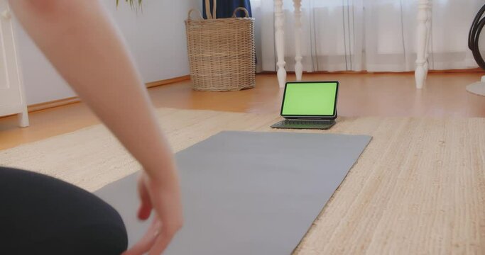 Exercising at home online yoga matress interior physical health Greenscreen Laptop Tablet watching 