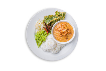 Above view of Thai rice noodle with peanut sauce with vegetables in plate isolated on white background. Kanom Jeen Nam Prik of Asian meal traditional style. Popular Thai food. Top-down