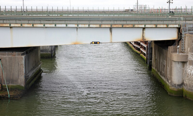 Old bridge with lights over dark water