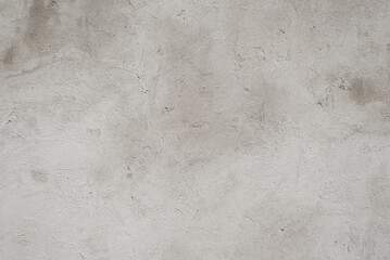 Gray rough concrete, cement stained floor or wall. Uneven texture background