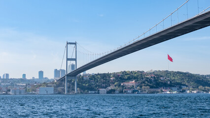 Landscape of the one side of the Bosphorus and the red flag of Turkey