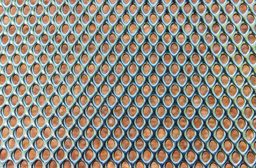 Dark gray plastic backrest of an outdoor cafe chair