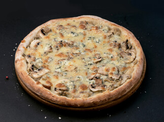 top view of italian pizza with mushrooms and cheese on black background