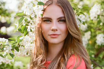Fototapeta premium Beautiful young woman in summer garden. Beauty summertime. Film photography