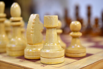 Chessboard with wooden pieces black and white