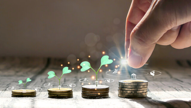 Man hand stacked coins with money saving concept and profit graph business finance in a piggy bank with money boxes for future funds of tourism, home, and retirement on a blurred background.