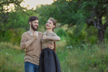 Fototapeta premium couple shows a gesture that everything is fine being in nature