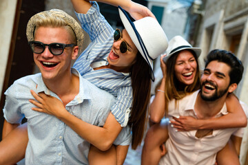 Group of happy friends enjoying travel and summer vacation together.