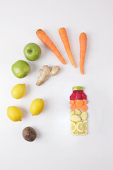 vegetables in bottle form on a white background