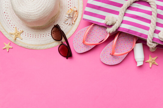 Summer vacation concept flat lay. straw hat beach accessories and towel top view. Space for text. travel concept