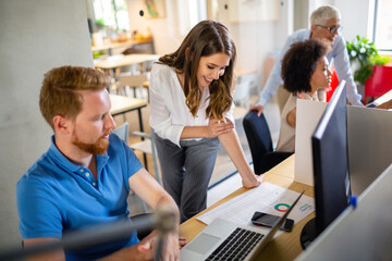 Group of programmer working in a software developing company office