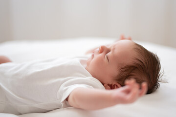 Fototapeta na wymiar one week old cute newborn infant baby boy expressions tiny feet details 