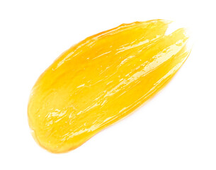 Yellow gel sugar honey smear smudge macro isolated on white background top view