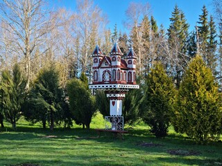 Unusual and beautiful fairy tale houses and carved wooden figures in the Latvian village of...