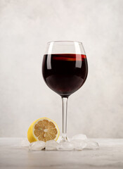 glass of red  wine on grey