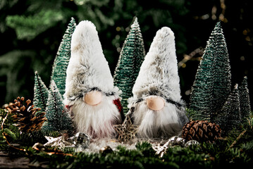 Merry christmas. Christmas composition with gnome and festive decorations on wooden background. Christmas or New Year greeting card. Noel gnome background. Christmas symbol. Happy Holidays.