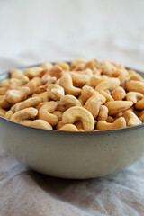Homemade Roasted and Salted Cashews in a Bowl, side view. Close-up.