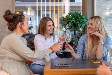 Girlfriends toasting in the restaurant