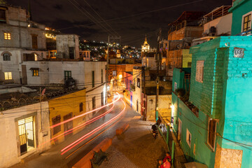 Night streets with car lights trails in City of Guanajuato, Mexico