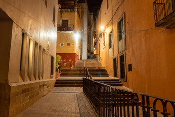 Night streets with car lights trails in City of Guanajuato, Mexico