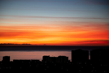 Fototapeta na wymiar Sunrise painting the sky over Mossel Bay