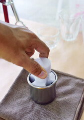 Press the coffee powder in the scoop firmly