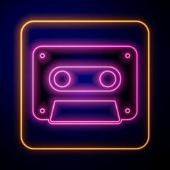 Glowing neon Retro audio cassette tape icon isolated on black background. Vector