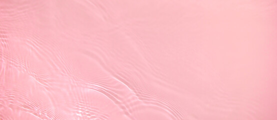 Abstract summer banner background Transparent pink clear water surface texture with ripples,...