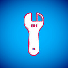 White Adjustable wrench icon isolated on blue background. Vector