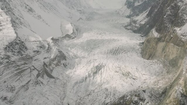 Drone Shot Over Frozen Pasu Glacier In Pakistan. Tilt up, Dolly Forward