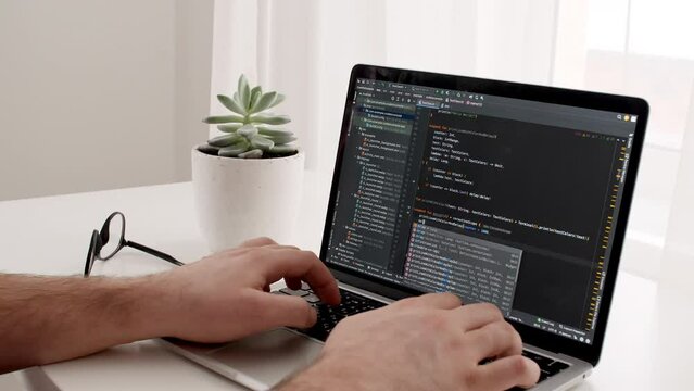 Coding on the screen, HTML encoding and programming on a laptop screen, developer, web development. Computer Web Developer. Cloud data social network media or virus. High quality 4k footage