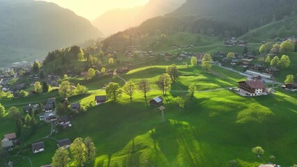 idyllic mountain landscape in Switzerland, aerial Swiss rural landscape in the morning, alpine village of Grindelwald in Swiss Alps, Swiss nature