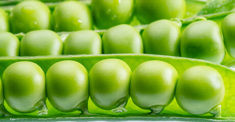 Rows of perfect green peas in pod close-up. Food background.
