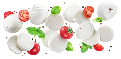 Foto op Plexiglas Flying slices of mozzarella cheese with cherry tomatoes, pepper and basil isolated on white background. © volff