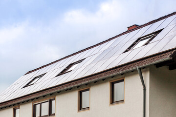 Solar Panel on House Roof. Modern Solar System Alternative Energy. Copy space.