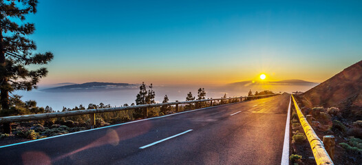  View of sunset over Island La Gomera from Teide National Park road. Tenerife Island.