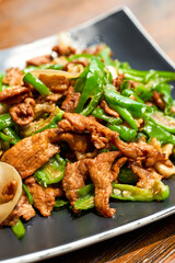 A plate of delicious and spicy Hunan dishes, fried pork with chili