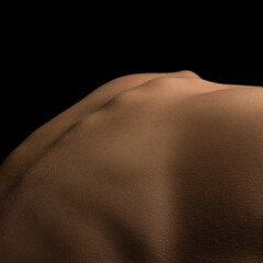 Back curve line. Detailed texture of human female skin. Close up part of woman's body. Skincare, bodycare, healthcare, hygiene and medicine concept.