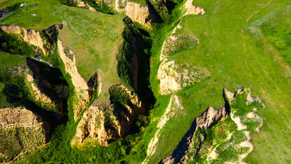 Canyon cliffs mountains green grass top view