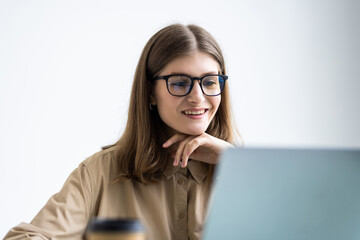 Young woman working with laptop from office